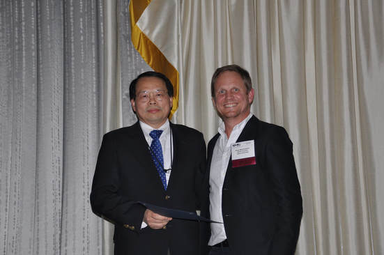 Jack Liu with US-IALE 2018 President Ross Meentemeyer 